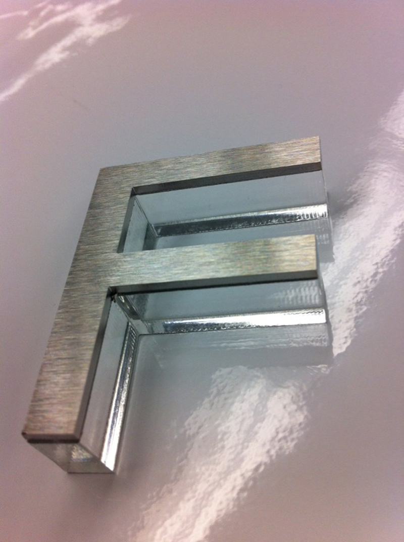 stainless steel letter mounted to acrylic letter_1